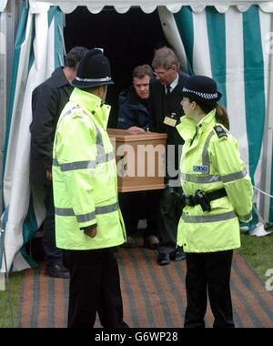 Rachel Whitear's coffin is led to a hearse, after it was exhumed at the Church of St Peter in Withington, near Hereford. It was originally thought that Miss Whitear died from a drugs overdose at her bedsit in Exmouth, Devon, but no post-mortem examination was carried out prior to an inquest which recorded an open verdict. Stock Photo