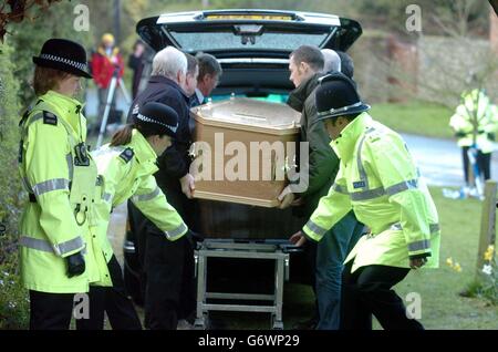 Rachel Whitear's coffin is led to a hearse, after it was exhumed at the Church of St Peter in Withington, near Hereford. It was originally thought that Miss Whitear died from a drugs overdose at her bedsit in Exmouth, Devon, but no post-mortem examination was carried out prior to an inquest which recorded an open verdict. Stock Photo