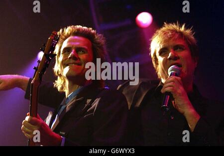 John Taylor (left) and Simon Le Bon of 80s pop group Duran Duran perform live in concert at Wembley Arena in west London Stock Photo