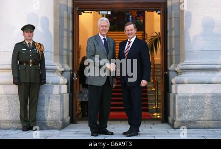 Former US President Bill Clinton (left) meets Taoiseach Enda Kenny at Government Buildings in Dublin. Stock Photo