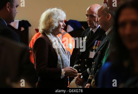 The Duchess of Cornwall meets members of the emergency services at St. Peter's and St. Paul's Church in Yalding, Kent, during a visit to the village to meet with local residents and business owners who were affected by the recent floods. Stock Photo