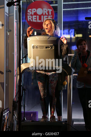 Radio 2 presenter Jo Whiley during her Sport Relief challenge - to run on a treadmill inside a perspex box for 26 hours whilst also presenting two live broadcasts of her BBC Radio 2 show - outside BBC Broadcasting House in central London. Stock Photo