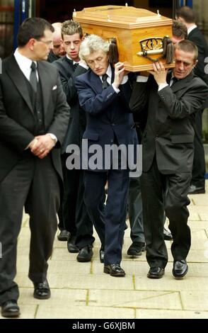 Family and friends of Kriss Donald carry his coffin from the Church of Jesus Christ of Latter Day Saints, in Pollock, Glasgow. Stock Photo