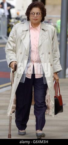 De-Laurey's GP mother, Dr Devi Schahhou arrives at Southwark Crown court, as the jury in the case of the top City secretary accused of fleecing her bosses of nearly 4.5 million was considering its verdict. Stock Photo