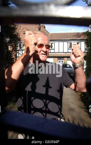 Former football pundit Ron Atkinson looks through the gates of his home at Barnt Green in Worcestershire, after resigning from ITV after an off-air remark about French defender Marcel Desailly was unwittingly broadcast to millions of viewers. Stock Photo