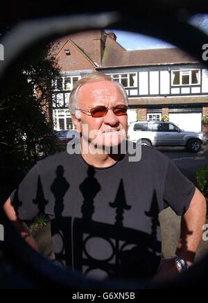 Former football pundit Ron Atkinson looks through the gates of his home at Barnt Green in Worcestershire, after resigning from ITV after an off-air remark about French defender Marcel Desailly was unwittingly broadcast to millions of viewers. Stock Photo