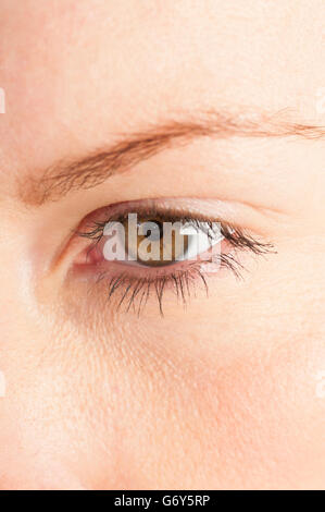 Close up of a pensive woman looking away Stock Photo
