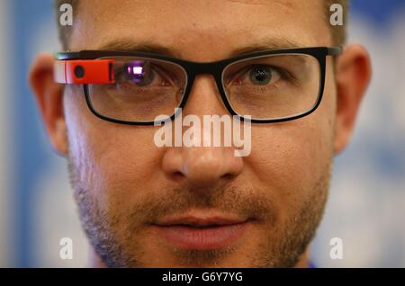 An exhibitor demonstrates Google Glass at the Wearable Technology Show held at Kensington Olympia, London. Stock Photo