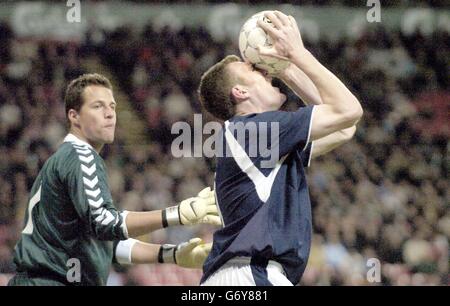 Scotland's striker Kevin Kyke shows his frustration watched by Denmarks goalkeeper Thomas Sorensen during the Denmark vs Scotland international football friendly match at the Parken Stadium, Copenhagen. Stock Photo