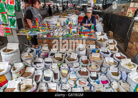 Selling seeds and spices in the Osh Bazaar, in Bishkek, Kyrgyzstan. Stock Photo