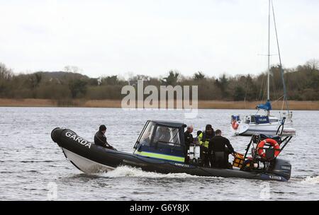 Members of the Garda sub aqua unit join the search of Lough Ree in Co Westmeath, for a man who is still missing following an accident where the boat he was in with two others capsized yesterday afternoon. Stock Photo