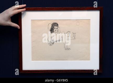 A drawing by the late John Lennon showing 'a hairy woman holding a miniature man by the arm', which is said to have first caught the interest of his wife Yoko Ono, goes on show at Sotheby's auction house in London as part of a sale of his drawings, poetry and prose which will take place on June 4th in New York. Stock Photo