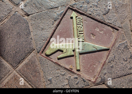 Sidewalk, plaque, indicating the direction of the Inca Trail in Cusco, Peru Stock Photo