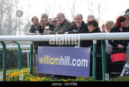 Horse Racing - 2014 William Hill Lincoln - Day One - Doncaster Racecourse. Racegoers observe the horses in the parade ring Stock Photo