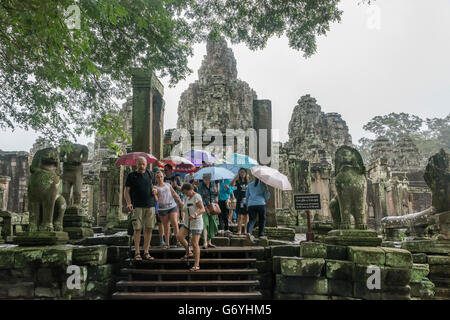 Tourists exiting the west side of Prasat Bayon, Angkor Thom, Siem Reap, Cambodia Stock Photo