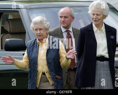 Britain's Queen Elizabeth II, chats with friends before watching her husband, the Duke Of Edinburgh compete in the 'dressage' event of the Carriage Driving Championships at the Royal Windsor Horse Show in Berkshire. Stock Photo