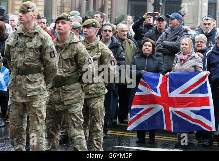 Royal Scots Dragoon Guards march through the streets of Glasgow during ...