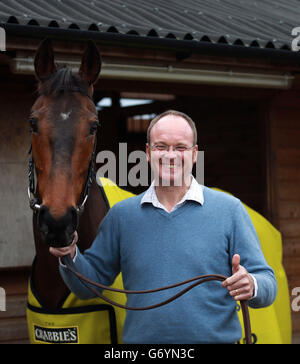 Horse Racing - The Crabbie's Grand National 2014 - Grand National Winners Photocall - Linacres Farm. Trainer Dr Richard Newland with Grand National winner Pineau De Re during a photocall at Linacres Farm, Worcester. Stock Photo