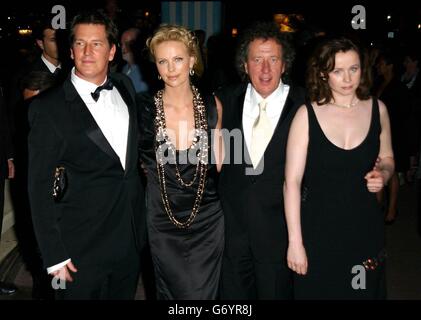 (From left to right) director Stephen Hopkins, co-stars Charlize Theron, Geoffrey Rush, and Emily Watson arrive at the HBO party for The Life And Death Of Peter Sellers at Martinez Beach during the 57th Cannes Film Festival in France. Stock Photo