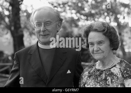 The Archbishop of Canterbury, Dr Donald Coggan, who announced he is to retire next January, leaving Lambeth Palace, London, with his wife, Jean, to attend a dinner being held by the Pharmaceutical Society of Great Britain. Stock Photo