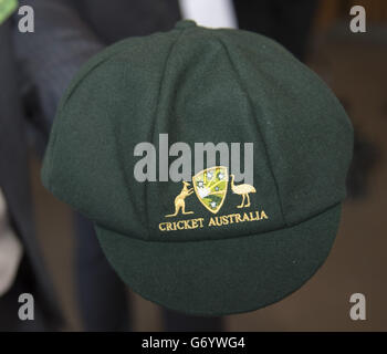 The Duke of Cambridge holds an Australian baggy green cap for Prince George, which was presented by Glen McGrath, at a reception hosted by the Governor and Premier of New South Wales at the Sydney Opera House, during the tenth day of their official tour to New Zealand and Australia. Stock Photo