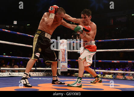 Boxing - Phones 4U Arena. Anthony Crolla (right) and John Murray during the WBO Inter-Continental Lightweight Title bout at the Phones 4U Arena, Manchester. Stock Photo