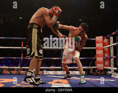 Boxing - Phones 4U Arena. Anthony Crolla (right) and John Murray during the WBO Inter-Continental Lightweight Title bout at the Phones 4U Arena, Manchester. Stock Photo