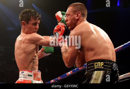 Anthony Crolla (left) and John Murray during the WBO Inter-Continental Lightweight Title bout at the Phones 4U Arena, Manchester. Stock Photo