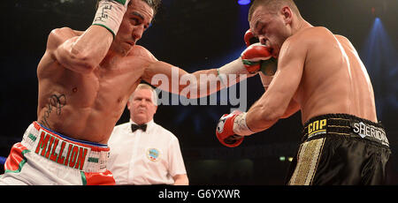 Anthony Crolla (left) catches John Murray with a punch during the WBO Inter-Continental Lightweight Title bout at the Phones 4U Arena, Manchester. Stock Photo