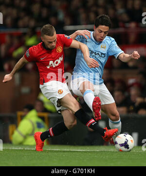 Manchester City's Samir Nasri battles for the ball with Stoke City's ...