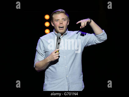 Rob Beckett performing on stage during the Teenage Cancer Trust series of charity gigs, at the Royal Albert Hall, in London. Stock Photo
