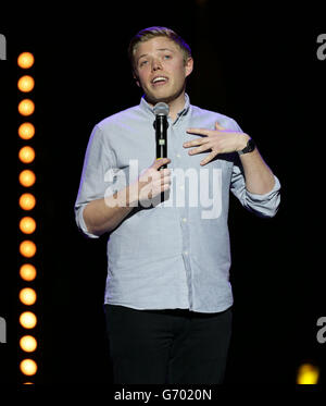 Rob Beckett performing on stage during the Teenage Cancer Trust series of charity gigs, at the Royal Albert Hall, in London. Stock Photo