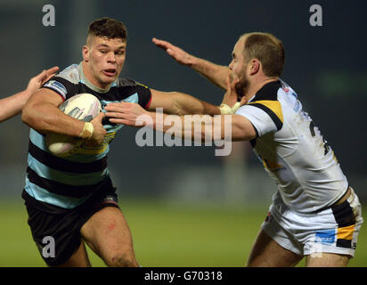 London Broncos' Alex Foster gets away from Castleford Tigers' Liam Finn (right) Stock Photo