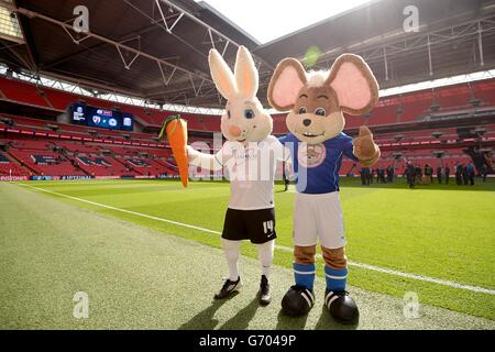 Peterborough United mascot Peter Burrow (left) and Chesterfield mascot Chester the Field Mouse pose for a photo before the game Stock Photo