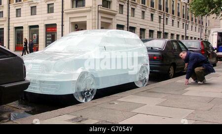 A Volkswagen (VW) Polo Twist, sculpted out of 8 tonnes of ice, is set up outside the Saatchi Gallery on the South Bank in London. The sculpture took 350 hours to make and was expected to melt within 12 hours. The stunt was created by VW to advertise the air-conditioning units fitted in the new range of vehicles. Stock Photo