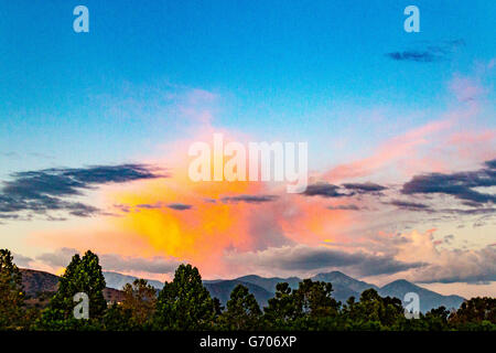 An illuminated cloud over Mount San Antonio in the San Gabriel Mountains in Southern California Stock Photo