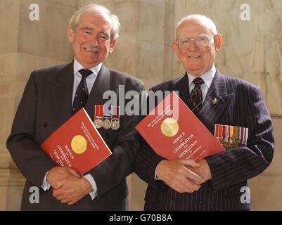 Patrick Brady BEM (left) and his father Charles Brady BEM from Aldershot, Hants, at St Paul's Cathedral in central London for a sevice for the Order of the British Empire. She was among more than 2,000 medal holders at the event, which is held every four years and was attended by Britain's Queen Elizabeth II and the Duke of Edinburgh. Former 007 Sir Roger Moore and Dame Norma Major were also present. Stock Photo