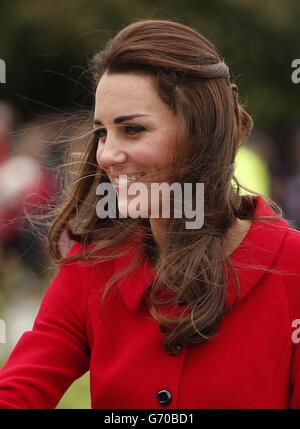 The Duchess of Cambridge, smiles as she arrives at the air force museum in Christchurch April 14, 2014. The Duke and Duchess of Cambridge are undertaking a 19-day official visit to New Zealand and Australia with their son, Prince George. Stock Photo