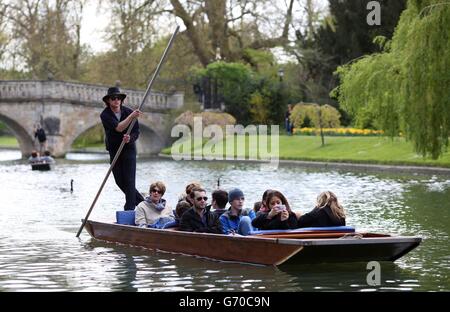 A punt makes it's way along the river Cam in the centre of Cambridge, as the mild temperatures enjoyed by most of Britain over the past few days will continue into next week before dipping on Good Friday.