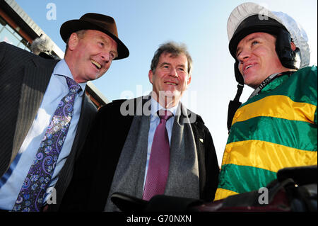 Trainer Jonjo O'Neill and owner JP McManus with jockey Barry Geraghty after he rode Shutthefrontdoor to victory in the Boylesports Irish Grand National Steeplechase during Irish Grand National Day at Fairyhouse Racecourse, County Meath, Ireland. PRESS ASSOCIATION Photo. Picture date: Monday April 21, 2014. See PA story RACING Fairyhouse. Photo credit should read: Barry Cronin/PA Wire. Stock Photo
