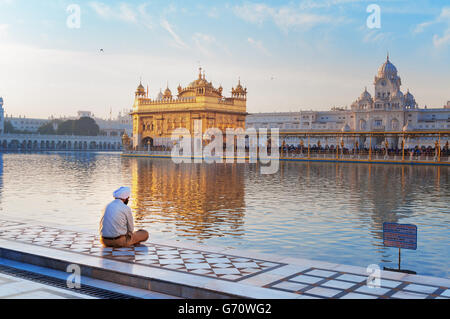 Unidentified Sikh man is praying in Golden Temple (Harmandir Sahib also Darbar Sahib) Stock Photo