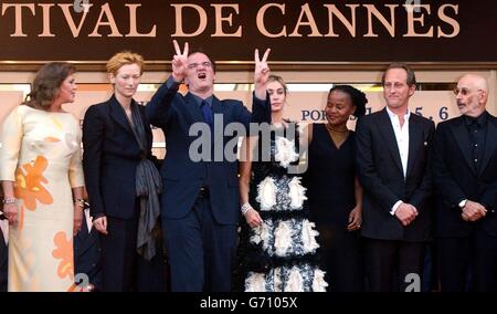 Jury members, from left to right; actress Kathleen Turner, actress Tilda Swinton, director Quentin Tarantino, actress Emmanuelle Beart, writer Edwidge Danticat, Belgian actor Benoit Poelvoorde and director Jerry Schatzberg arrive for a special screening of Michael Moore's Fahrenheit 9/11 as part of the 57th Cannes Film Festival in France. Stock Photo