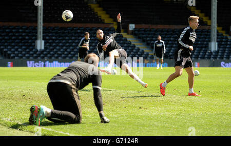 Fulham's Patjim Kasami has a shot on goal during an open training session at Craven Cottage Stock Photo