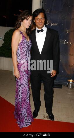 Actress and model Elizabeth Hurley and her boyfriend Arun Nayar arrive for The Chopard Trophy Awards at Palm Beach, as part of the 57th Cannes Film Festival, in France. Stock Photo