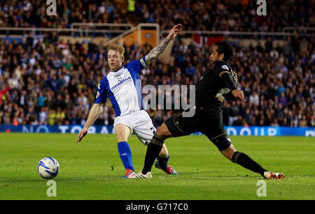 Soccer - Sky Bet Championship - Birmingham City v Wigan Athletic - St Andrews. Birmingham City's Chris Burke and Wigan's Jean Beausejour during the Sky Bet Championship match at St Andrews Stadium, Birmingham. Stock Photo