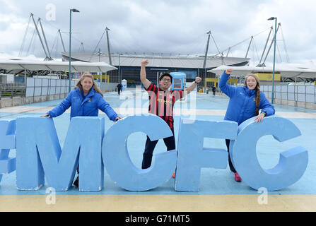 Manchester City fan Nadmin Roshdi poses with an MCFC sign before the Barclays Premier League match at the Etihad Stadium, Manchester. Stock Photo