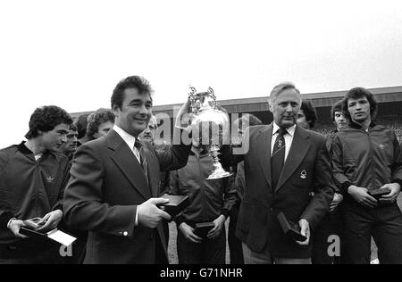 Nottingham Forest manager Brian Clough (left) and assistant manager Peter Taylor, holding the League Championship trophy after it had been presented to Forest at the County Ground in Nottingham. 20/09/04: The former Forest and Derby County manager has died. A hospital spokeswoman said Brian Clough, who was 69, had been suffering from stomach cancer. Stock Photo