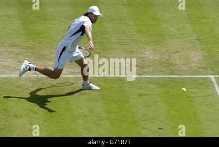 Great Britain's Greg Rusedski in action against Rainer Schuettler from Germany at The Lawn Tennis Championships in Wimbledon, London. EDITORIAL USE ONLY, NO MOBILE PHONE USE. Stock Photo