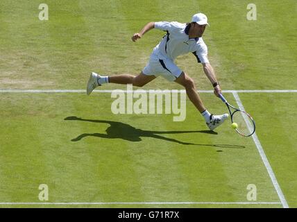 Great Britain's Greg Rusedski in action against Rainer Schuettler from Germany at The Lawn Tennis Championships in Wimbledon, London. EDITORIAL USE ONLY, NO MOBILE PHONE USE. Stock Photo