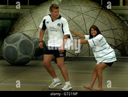 Scottish rugby star Simon Taylor launches the new Scottish Rugby strip, with the help of Miss Scotland, Nicola Jolly during a photocall at the Festival Square in Edinburgh. Stock Photo